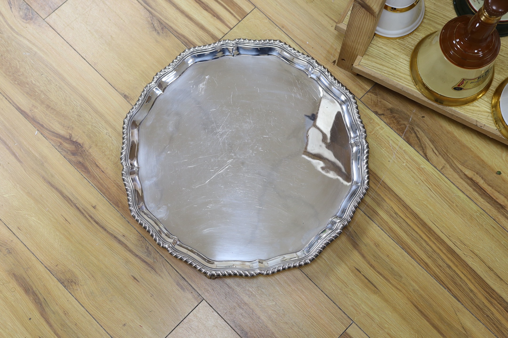 A large silver plated two handled tray and a similar salver, tray 65 cms wide